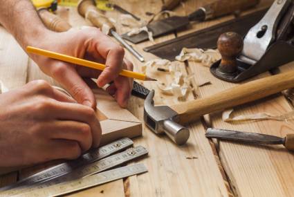 Carpenter,Working,hammer,meter,And,Screw-driver,On,Construction,Background